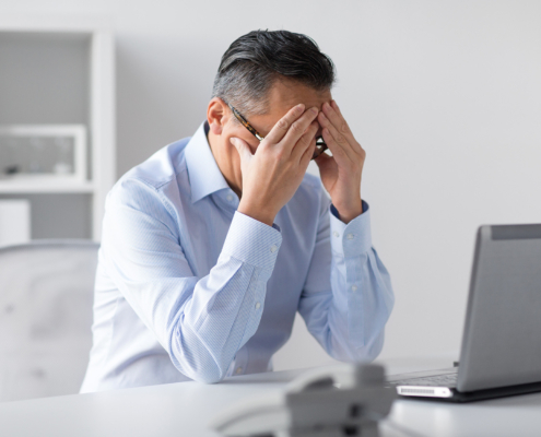 Stressed person at computer