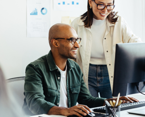 Two workers at computer