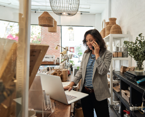 small business owner looking at laptop